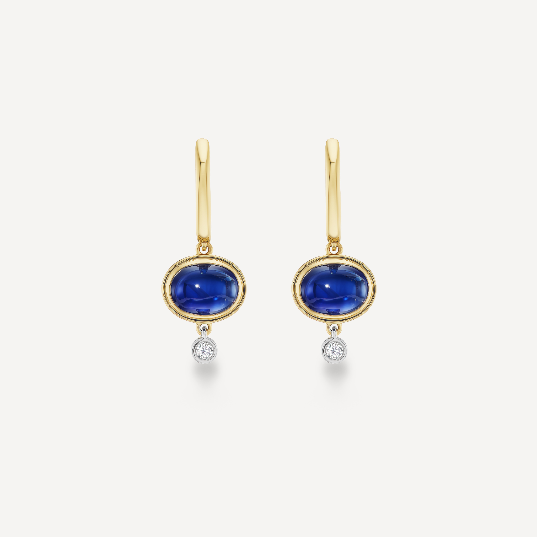 Oval blue sapphire cabochon drop earrings in 14K yellow gold with white gold diamond drops
